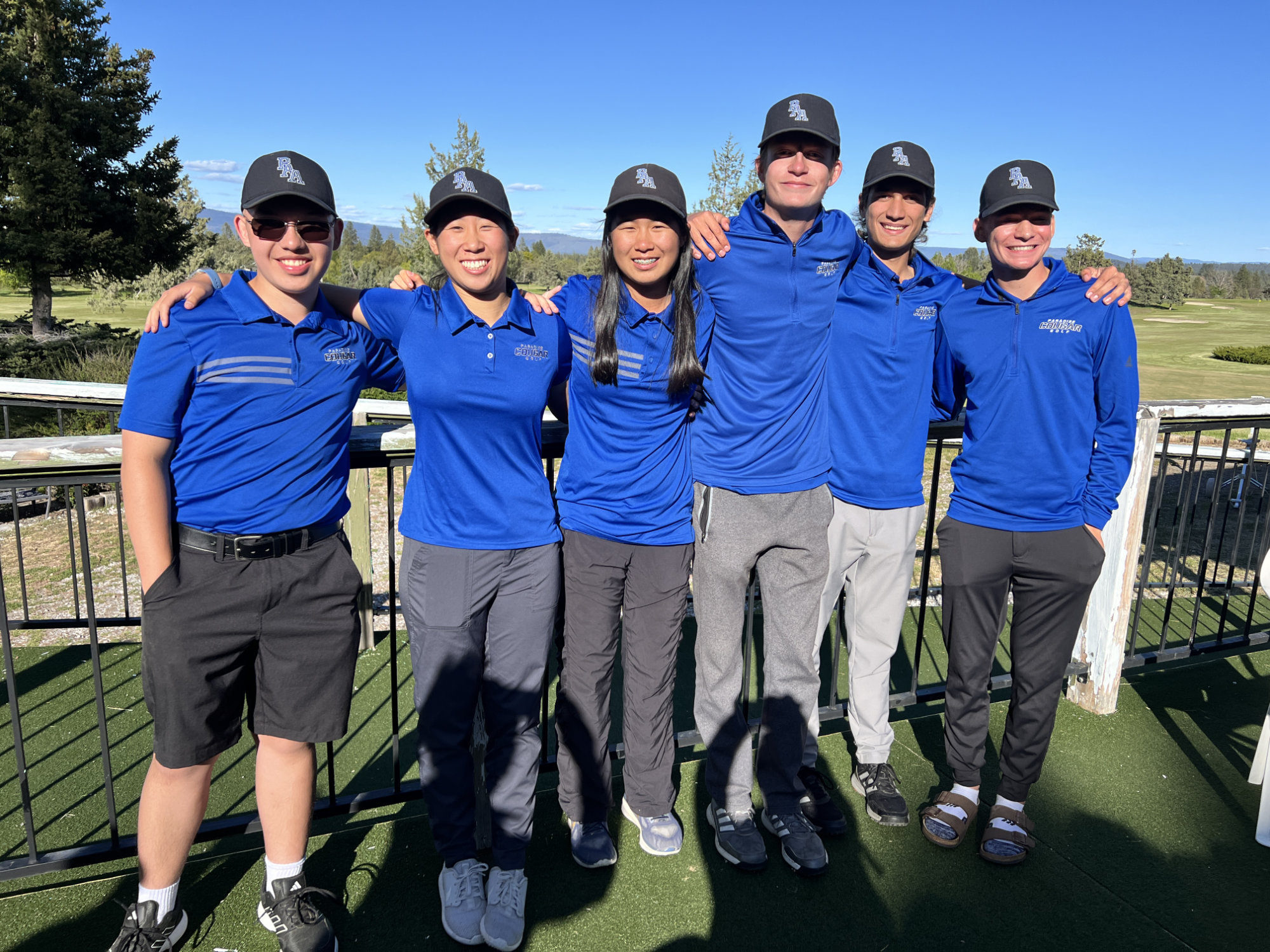 Golf team in matching outfits; related to admissions.